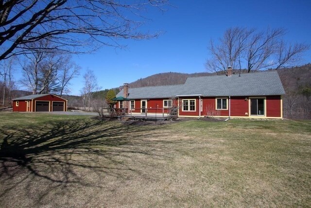 310 S River Rd, Charlemont, MA 01339 - back of property featuring an outdoor structure, a detached garage, a deck, and a chimney
