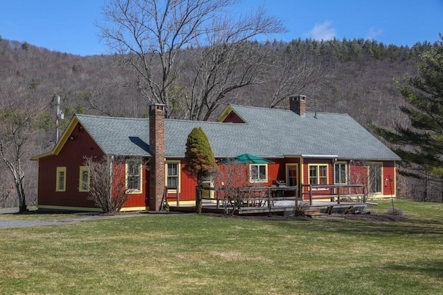 310 S River Rd, Charlemont, MA 01339 - rear view of house featuring roof with shingles, a yard, a deck with mountain view, and a chimney