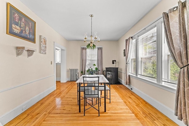 51 Gifford St, Brockton, MA 02301 - dining room featuring a chandelier, healthy amount of natural light, light wood-style floors, and baseboards