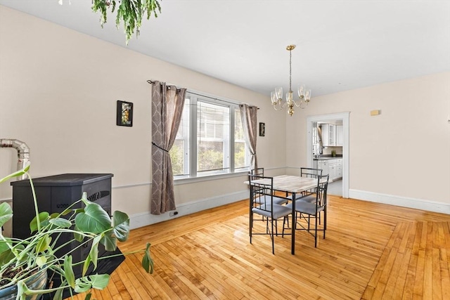 51 Gifford St, Brockton, MA 02301 - dining area featuring a chandelier, baseboards, and hardwood / wood-style floors