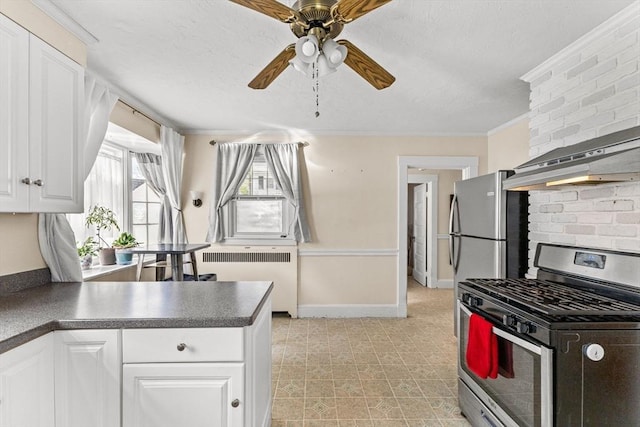 51 Gifford St, Brockton, MA 02301 - kitchen with gas range, radiator heating unit, dark countertops, and white cabinetry