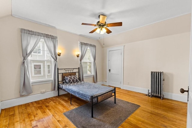 51 Gifford St, Brockton, MA 02301 - bedroom with radiator, hardwood / wood-style floors, vaulted ceiling, baseboards, and ceiling fan