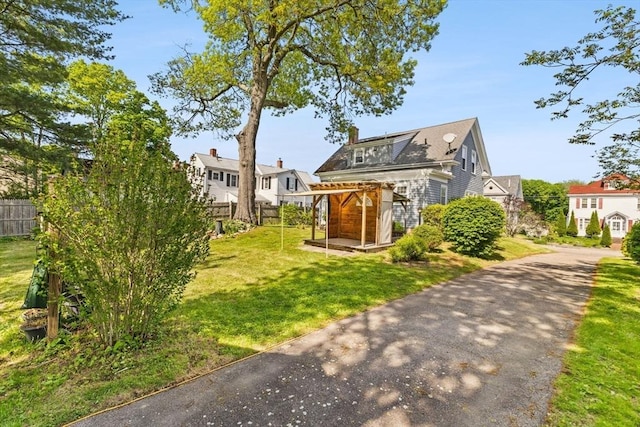 51 Gifford St, Brockton, MA 02301 - view of front of house featuring a chimney and asphalt driveway