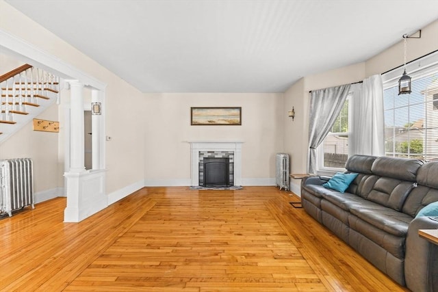 51 Gifford St, Brockton, MA 02301 - living area featuring radiator, light wood-type flooring, and baseboards