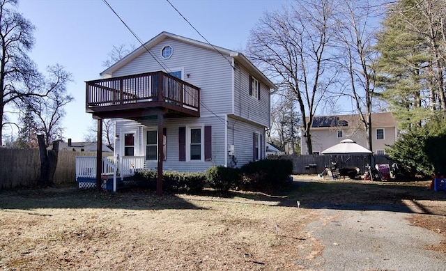 view of front of home with a gazebo and a wooden deck