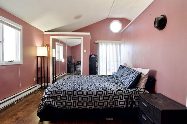 bedroom with a baseboard radiator, a closet, lofted ceiling, and dark hardwood / wood-style floors