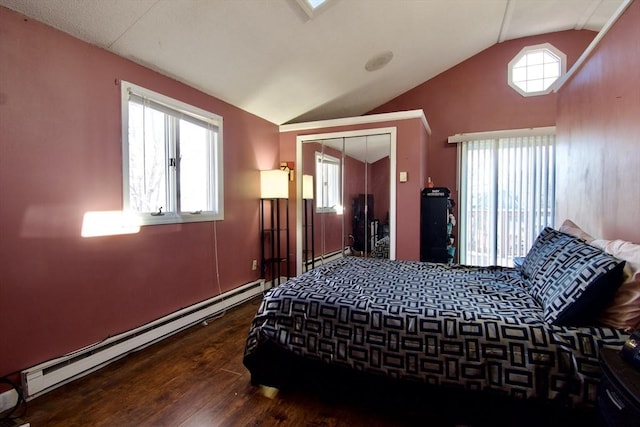 bedroom featuring multiple windows, a closet, a baseboard radiator, and lofted ceiling