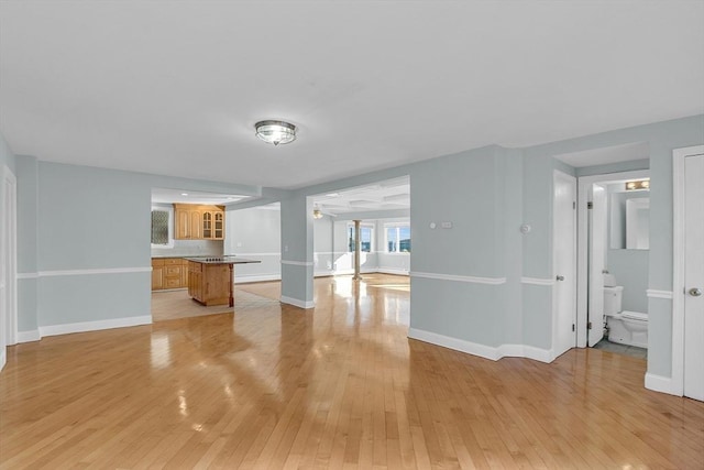 unfurnished living room featuring light wood-type flooring