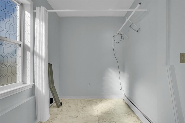 interior space featuring baseboard heating