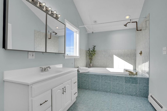 bathroom with tile patterned floors, vanity, baseboard heating, a relaxing tiled tub, and lofted ceiling