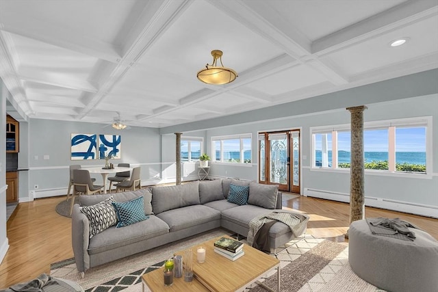 living room featuring ceiling fan, light hardwood / wood-style flooring, beamed ceiling, and coffered ceiling