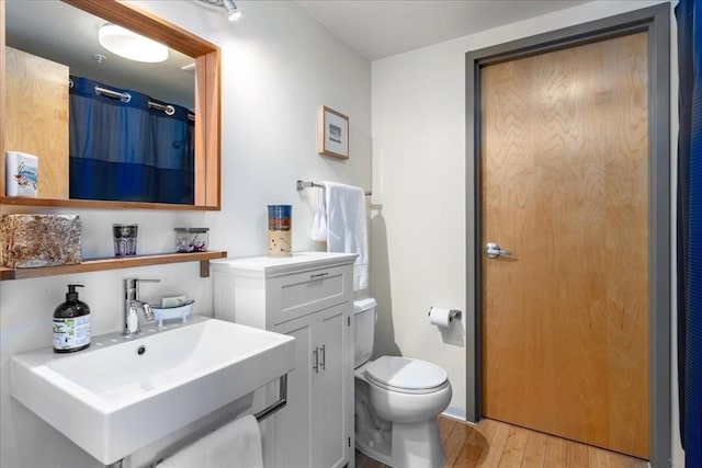 156 Porter St Unit 434, Boston, MA 02128 - full bathroom with wood finished floors and vanity