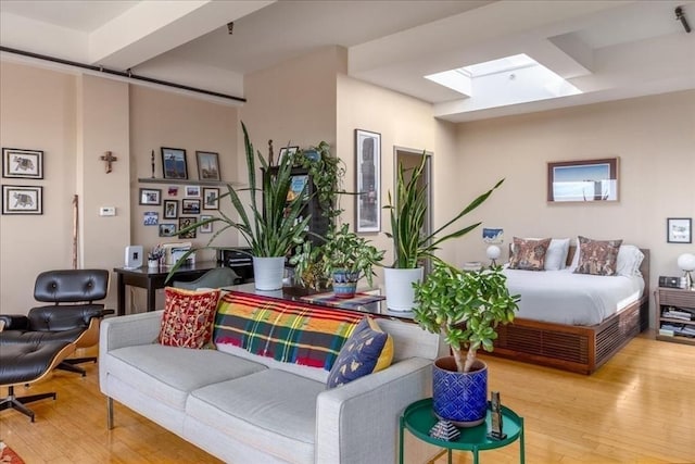 156 Porter St Unit 434, Boston, MA 02128 - living room featuring hardwood / wood-style floors and a skylight