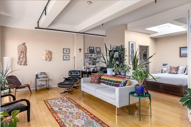 156 Porter St Unit 434, Boston, MA 02128 - living room featuring a skylight and wood-type flooring