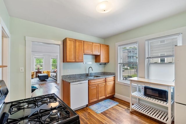 111 Williams St Unit 3, Boston, MA 02130 - kitchen featuring white appliances, light wood finished floors, and light stone counters