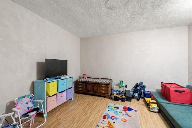24 Springwell Rd, Billerica, MA 01821 - rec room featuring wood finished floors and a textured ceiling