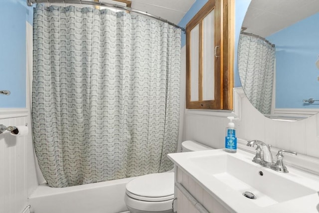 24 Springwell Rd, Billerica, MA 01821 - bathroom featuring vanity, shower / bath combo with shower curtain, a decorative wall, and wainscoting