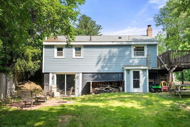 24 Springwell Rd, Billerica, MA 01821 - rear view of house with a deck and a chimney