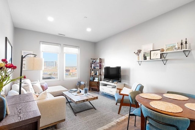 living room with recessed lighting and wood finished floors
