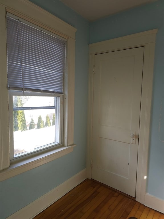 empty room with light hardwood / wood-style flooring