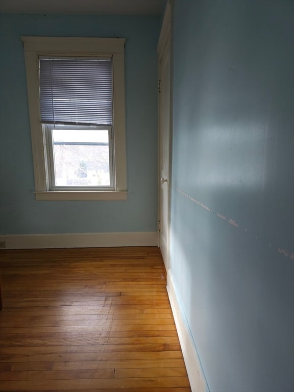 unfurnished room with light hardwood / wood-style floors