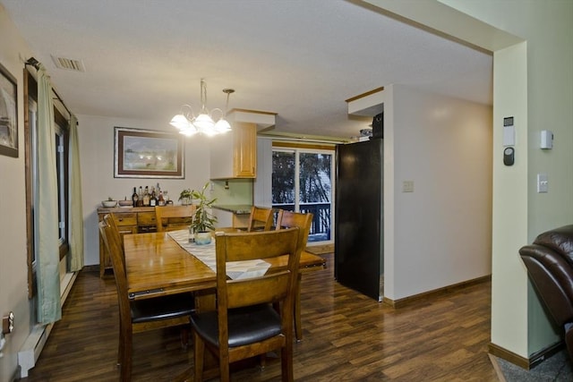 dining room featuring a baseboard radiator, a chandelier, and dark hardwood / wood-style flooring