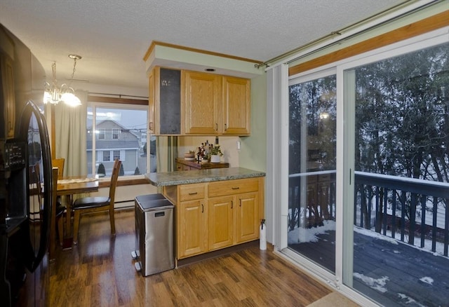 kitchen with an inviting chandelier, dark hardwood / wood-style floors, black fridge with ice dispenser, and a textured ceiling