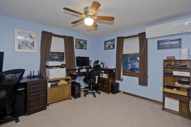 office featuring ceiling fan, light colored carpet, a wall mounted air conditioner, and a textured ceiling