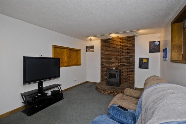 carpeted living room with a textured ceiling and a wood stove