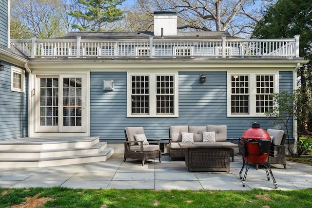 view of patio / terrace with an outdoor hangout area and a balcony