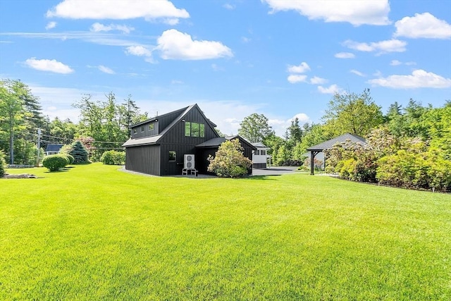 481 W Townsend Rd, Lunenburg, MA 01462 - rear view of property with a yard and board and batten siding