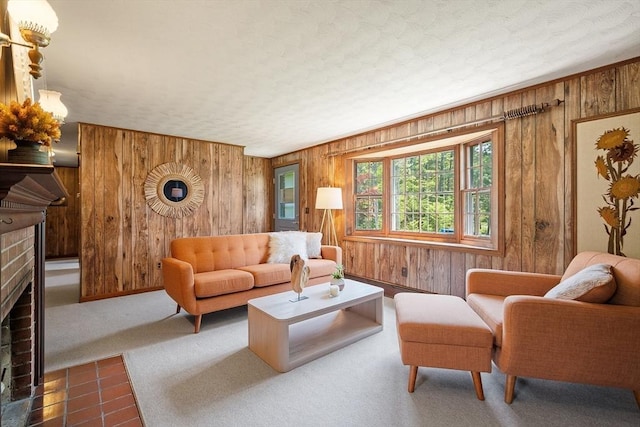 481 W Townsend Rd, Lunenburg, MA 01462 - living area featuring wooden walls, a fireplace, carpet floors, and a textured ceiling