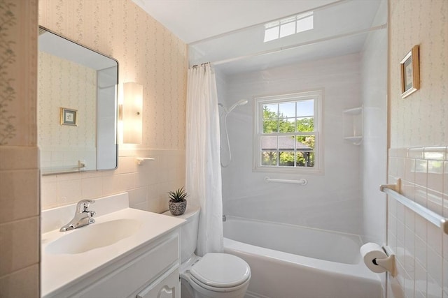 481 W Townsend Rd, Lunenburg, MA 01462 - bathroom with wallpapered walls, tile walls, vanity, shower / bath combination with curtain, and wainscoting