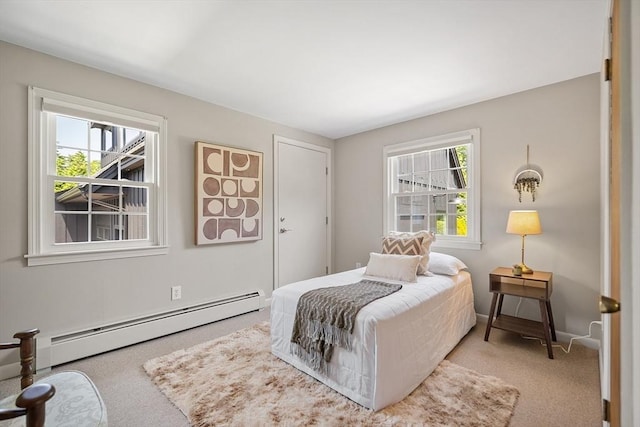 481 W Townsend Rd, Lunenburg, MA 01462 - bedroom with a baseboard heating unit and carpet