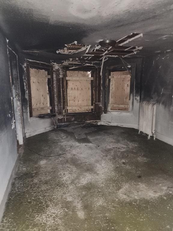 misc room with concrete flooring