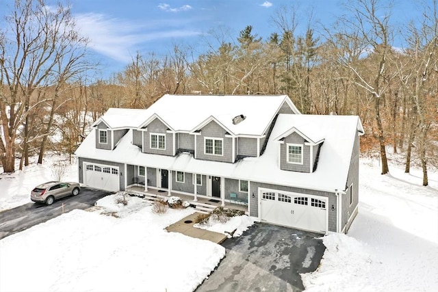 view of front of house featuring a garage and a porch