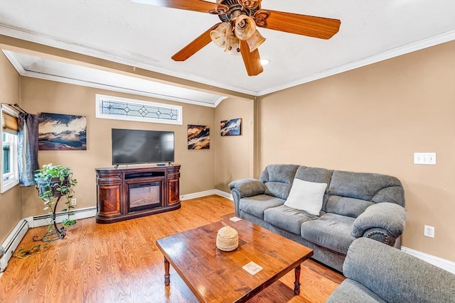 50 Walnut St, Lynn, MA 01905 - living room with ornamental molding, wood finished floors, baseboards, ceiling fan, and a glass covered fireplace