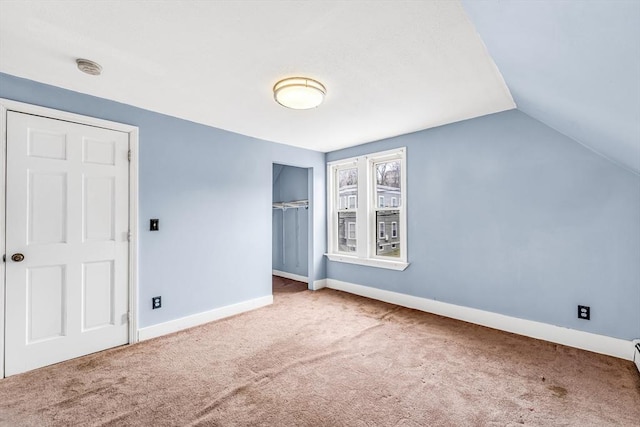 50 Walnut St, Lynn, MA 01905 - unfurnished bedroom featuring carpet floors, a closet, vaulted ceiling, and baseboards