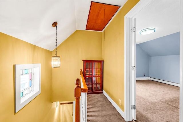 50 Walnut St, Lynn, MA 01905 - hallway featuring lofted ceiling, baseboard heating, carpet flooring, baseboards, and an upstairs landing