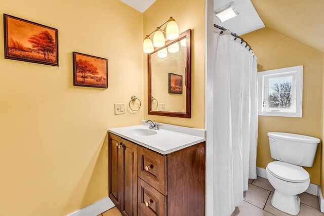 50 Walnut St, Lynn, MA 01905 - bathroom featuring toilet, vanity, tile patterned flooring, vaulted ceiling, and baseboards