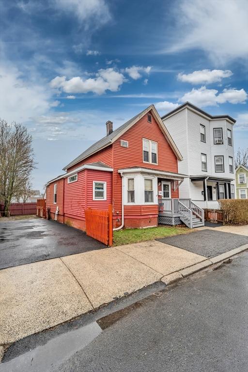 50 Walnut St, Lynn, MA 01905 - view of front of property featuring driveway and a chimney