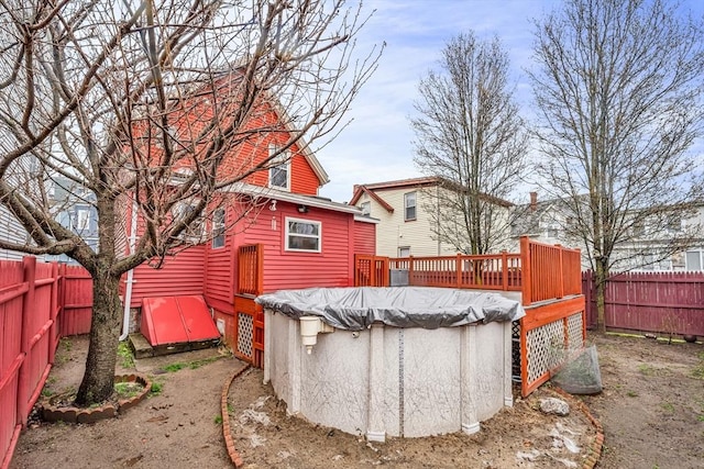 50 Walnut St, Lynn, MA 01905 - rear view of house featuring a covered pool, a fenced backyard, and a wooden deck
