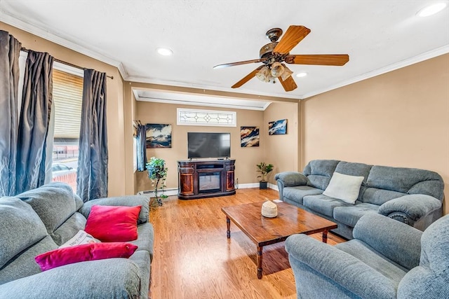 50 Walnut St, Lynn, MA 01905 - living room featuring a baseboard heating unit, wood finished floors, baseboards, ornamental molding, and recessed lighting