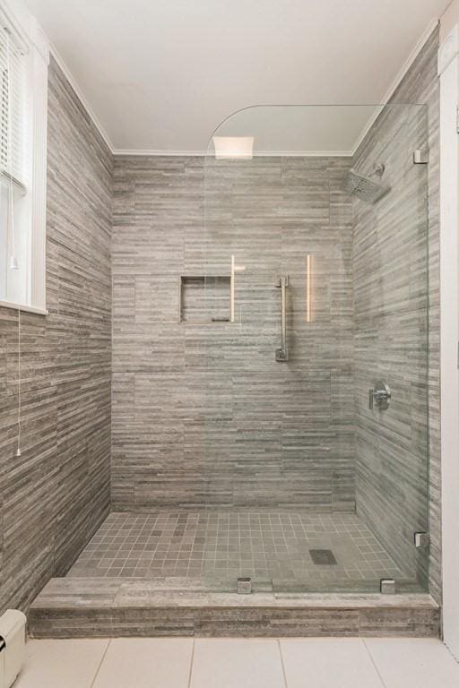 36 Brookford St, Boston, MA 02125 - full bathroom with tile patterned flooring, a shower stall, crown molding, and a baseboard radiator