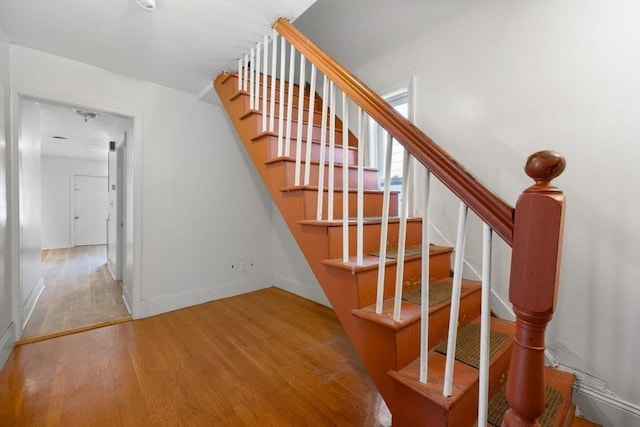 36 Brookford St, Boston, MA 02125 - staircase featuring wood finished floors and baseboards