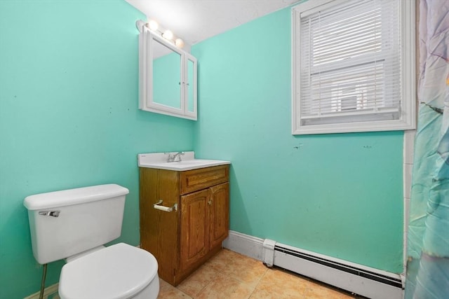 36 Brookford St, Boston, MA 02125 - bathroom with a baseboard radiator, vanity, toilet, baseboards, and tile patterned flooring