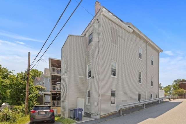 36 Brookford St, Boston, MA 02125 - view of home's exterior with a chimney