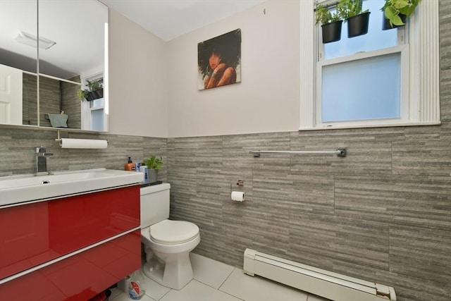 36 Brookford St, Boston, MA 02125 - full bathroom featuring tile walls, a baseboard heating unit, tile patterned flooring, vanity, and toilet
