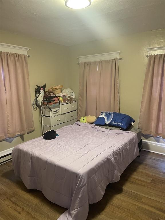 bedroom with wood finished floors