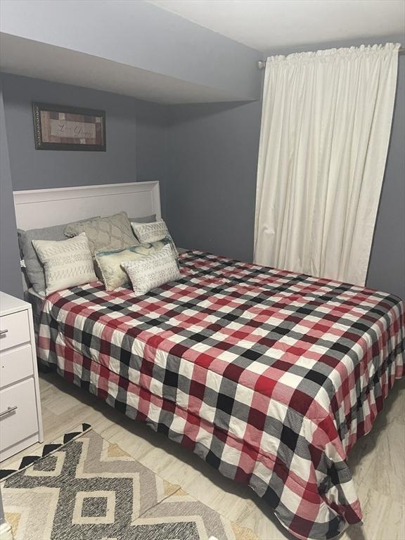 bedroom with light wood-style floors